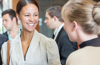 Woman laughing at networking event